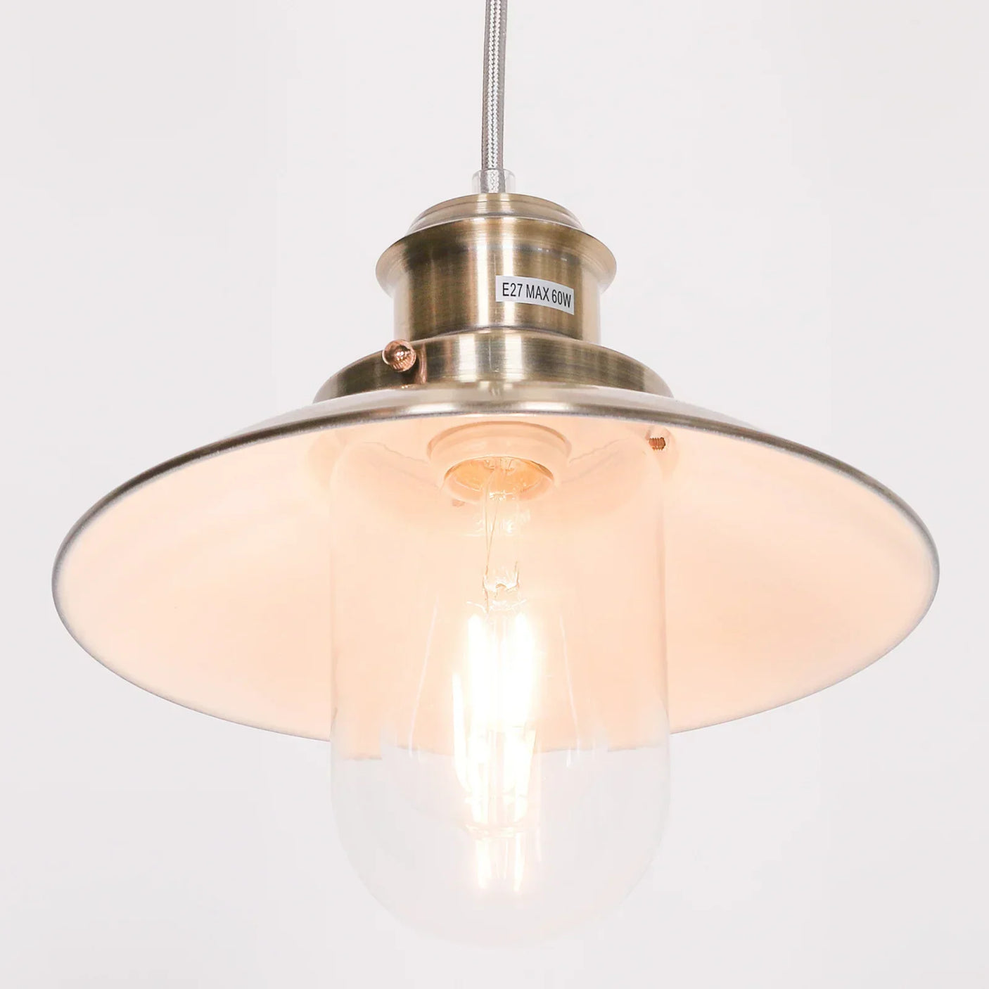 Brushed metal pendant ceiling light with clear glass shade and exposed bulb