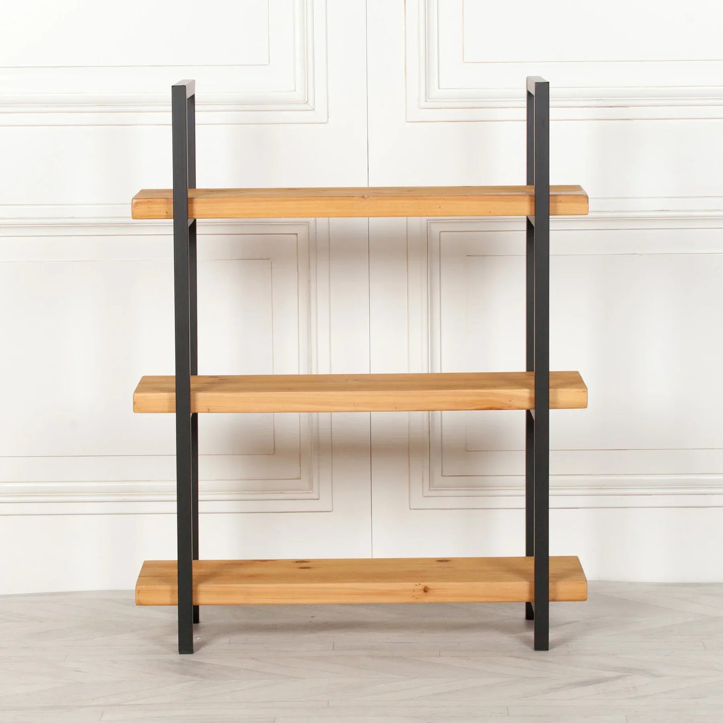 Industrial style shelving unit with three wooden shelves and black metal frame front view