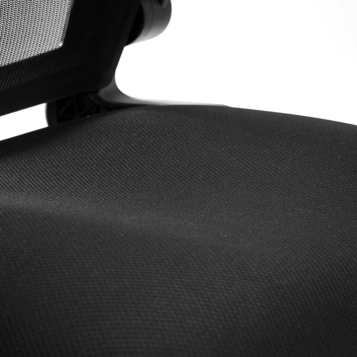 Imola office chair close-up showing black mesh backrest and textured fabric seat