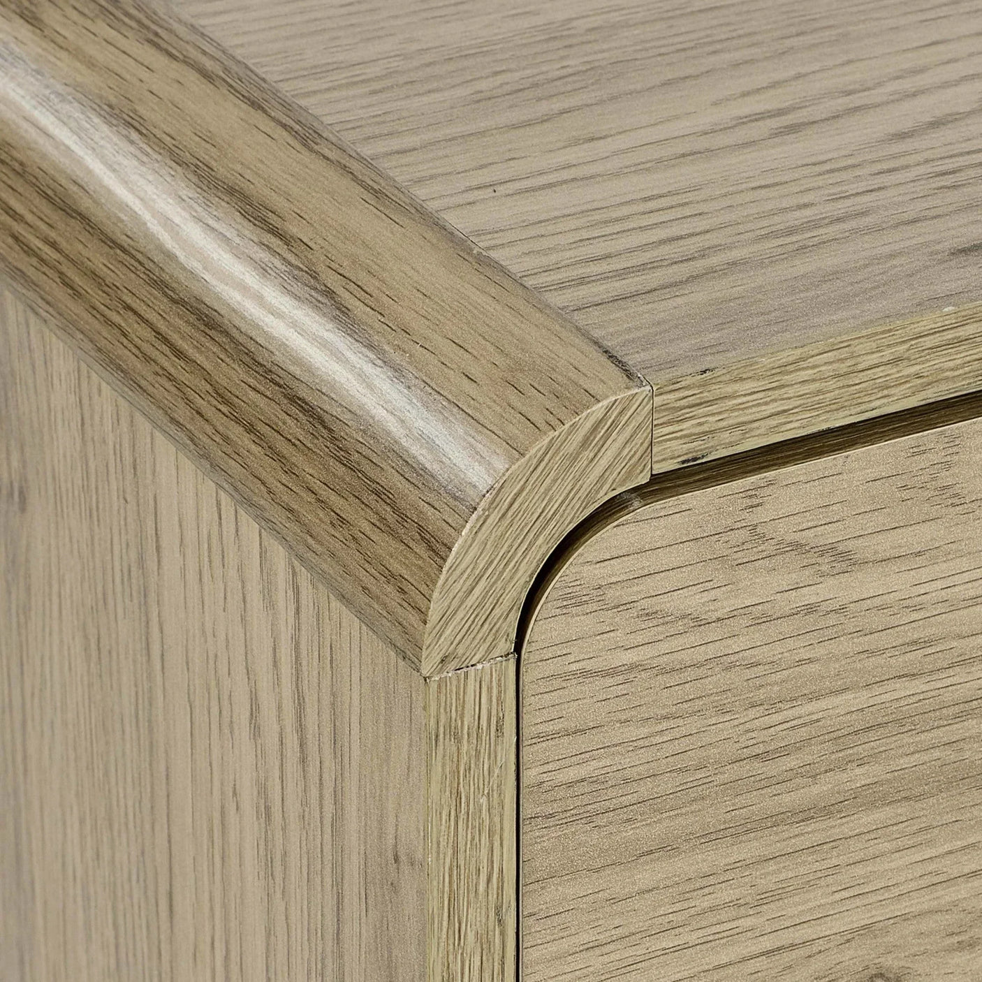 Closeup of oak wood furniture corner with rounded edge detail