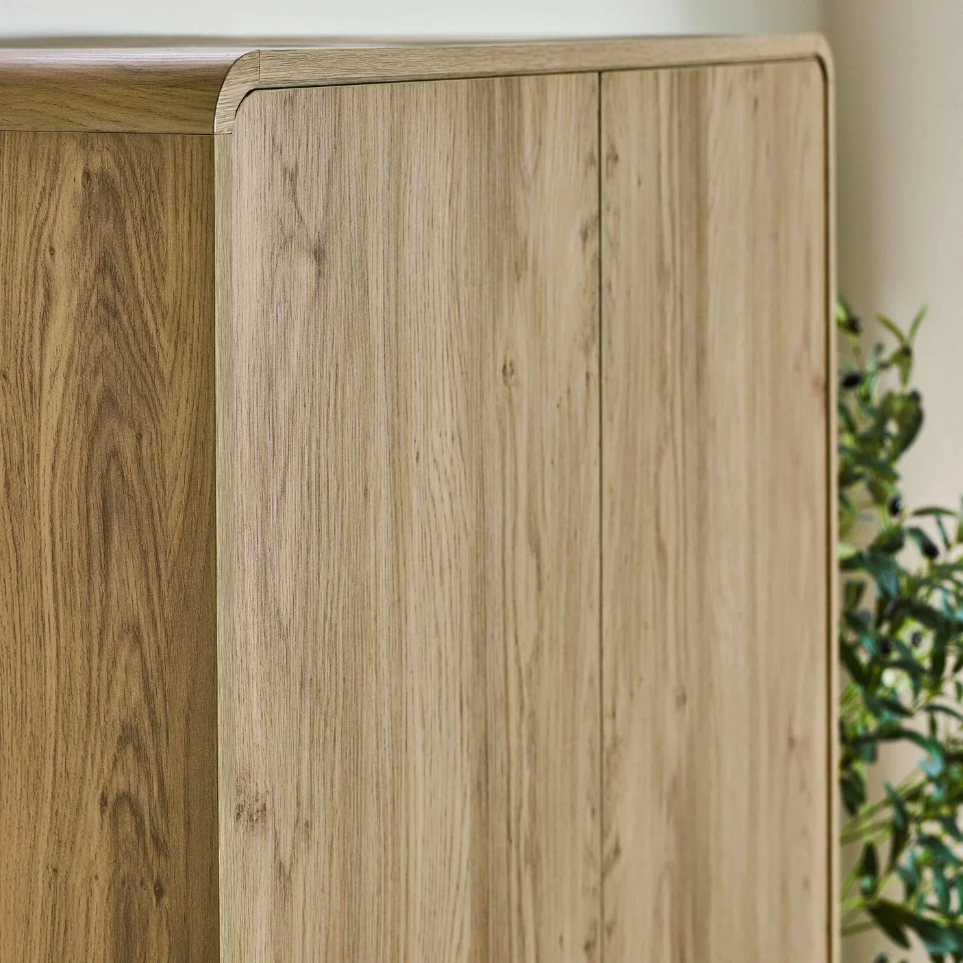 Oak effect wooden cabinet with smooth rounded edges and natural grain detail