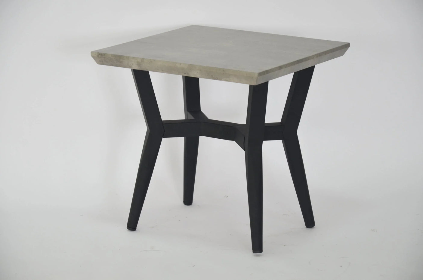 Modern square table with grey concrete top and black metal legs