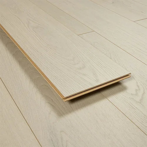 ivory oak wood flooring plank with light grain detail laying on matching floorboards