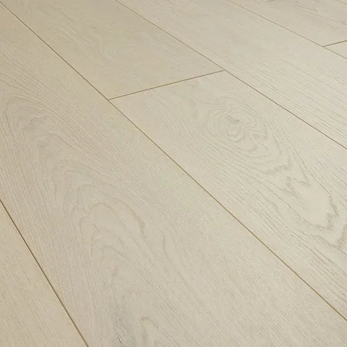 Ivory oak laminate flooring with wood grain texture and wide plank design