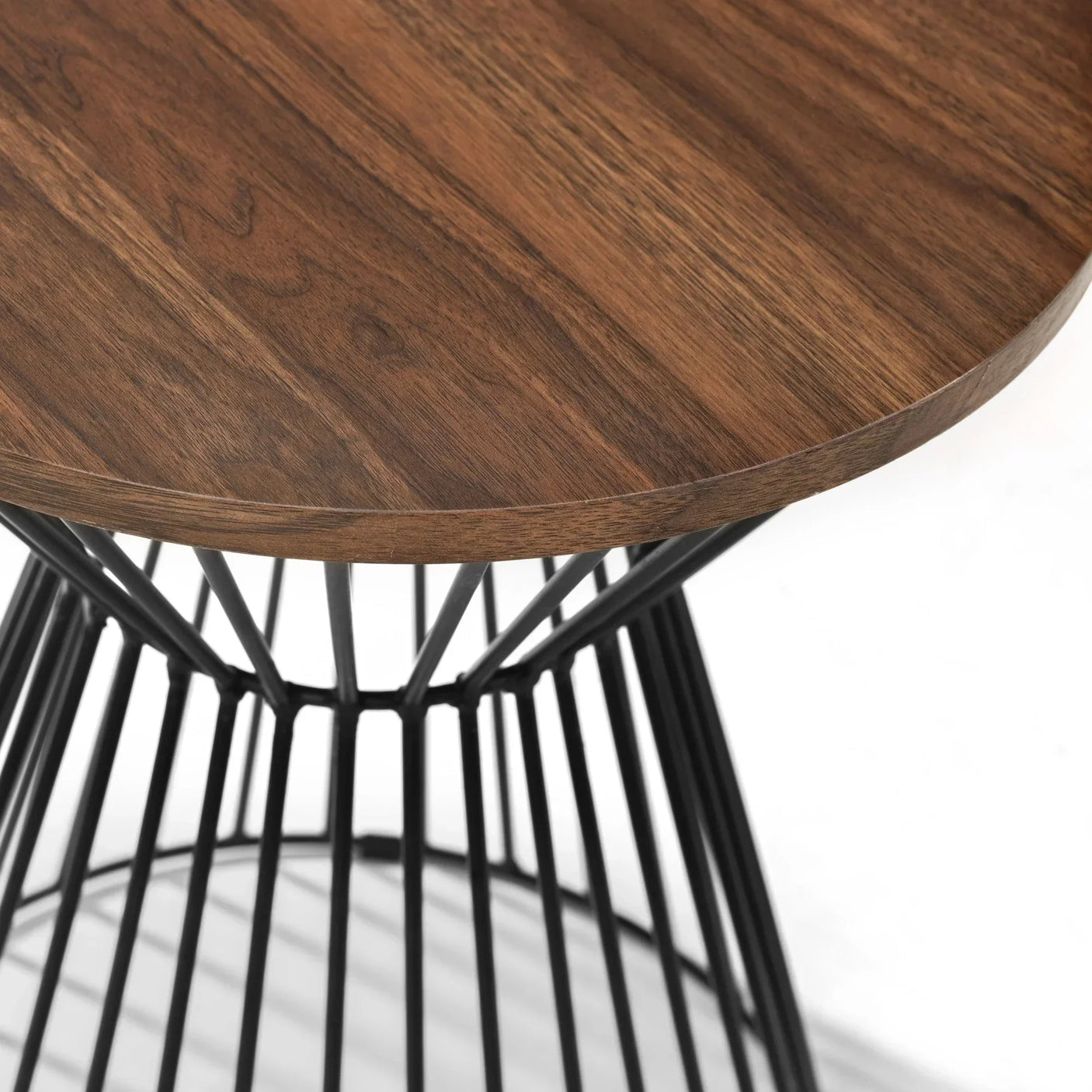 Round wood side table with black metal wire base, close up of tabletop and frame