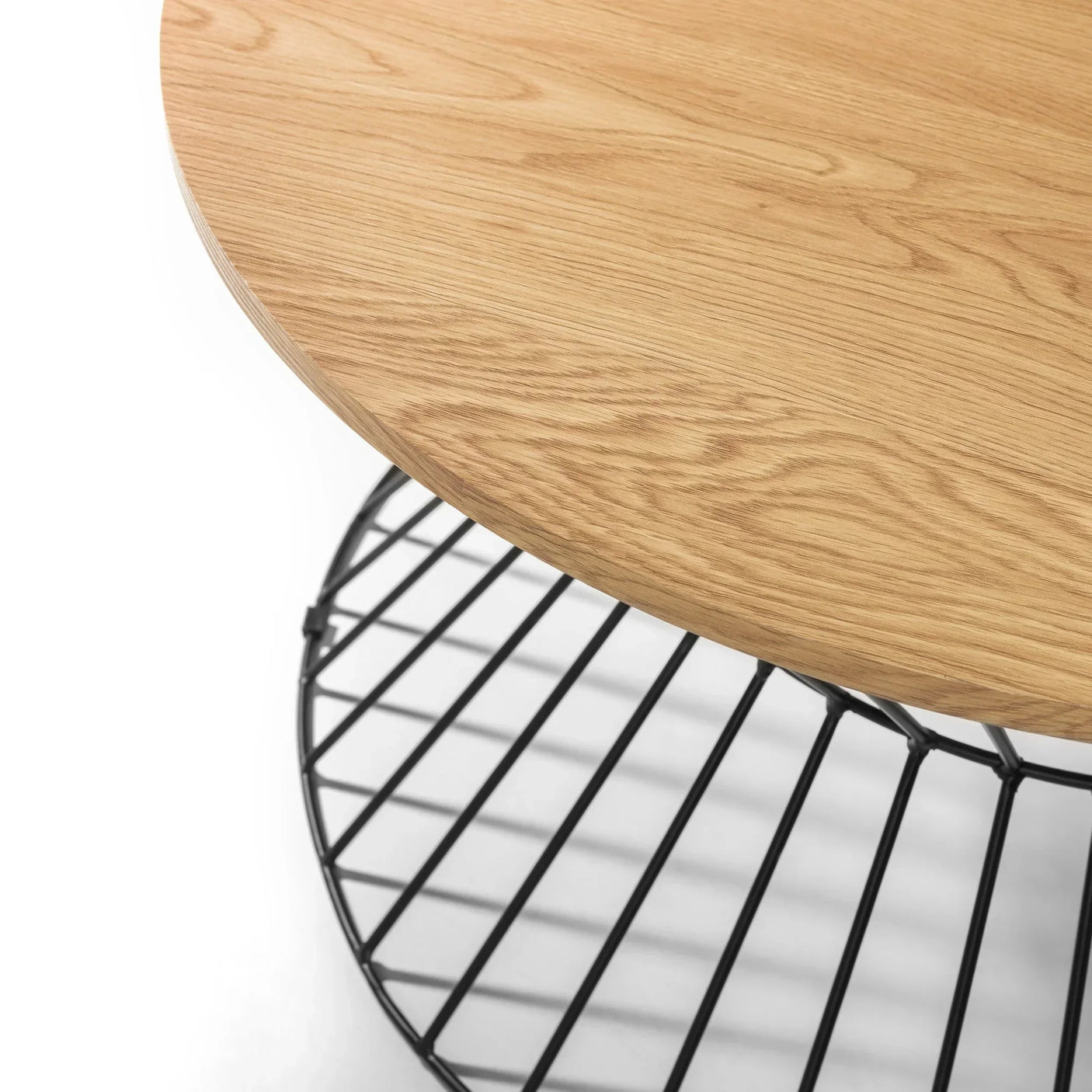Round oak coffee table with black metal wire base, close view of tabletop and shelf