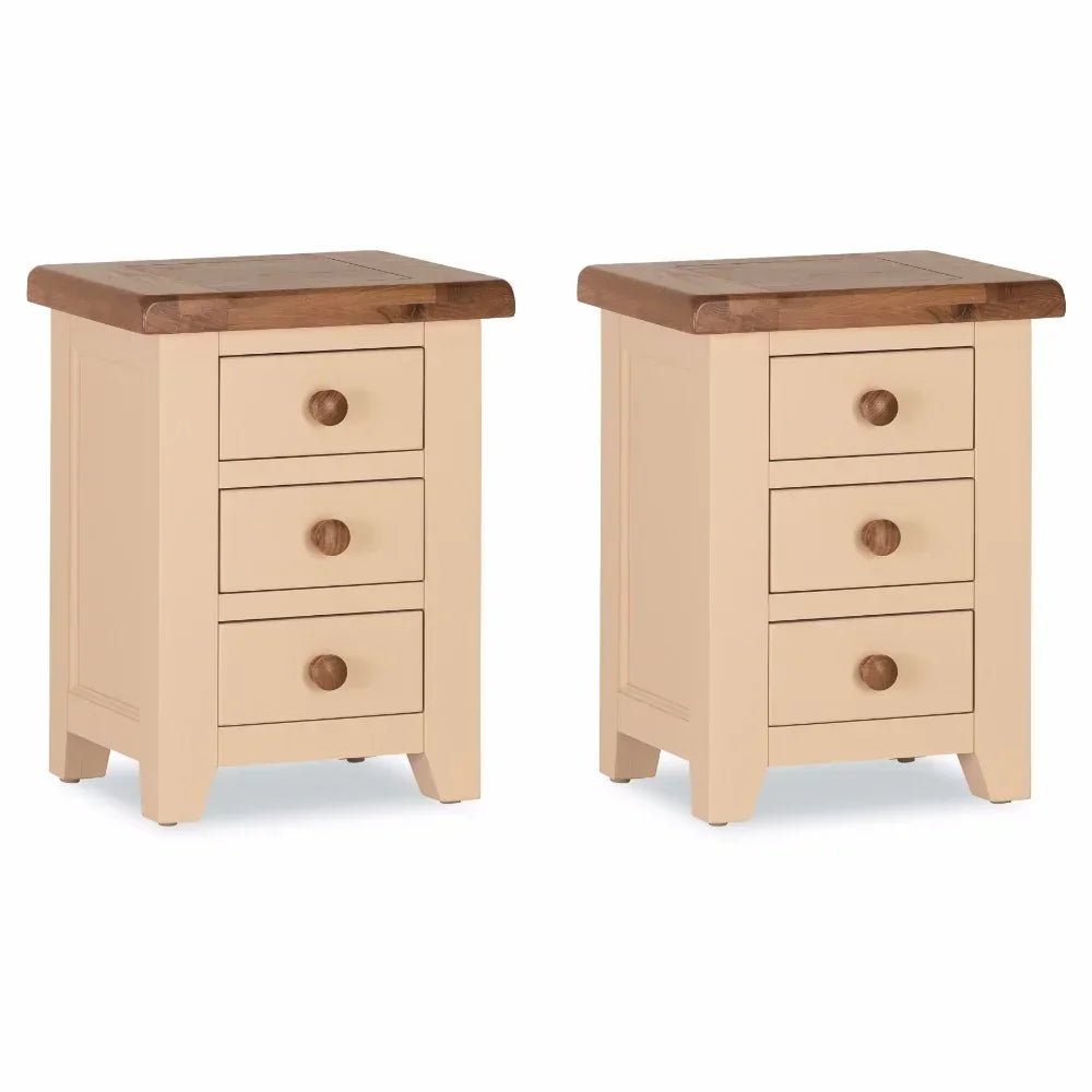Pair of cream bedside tables with three drawers and oak tops