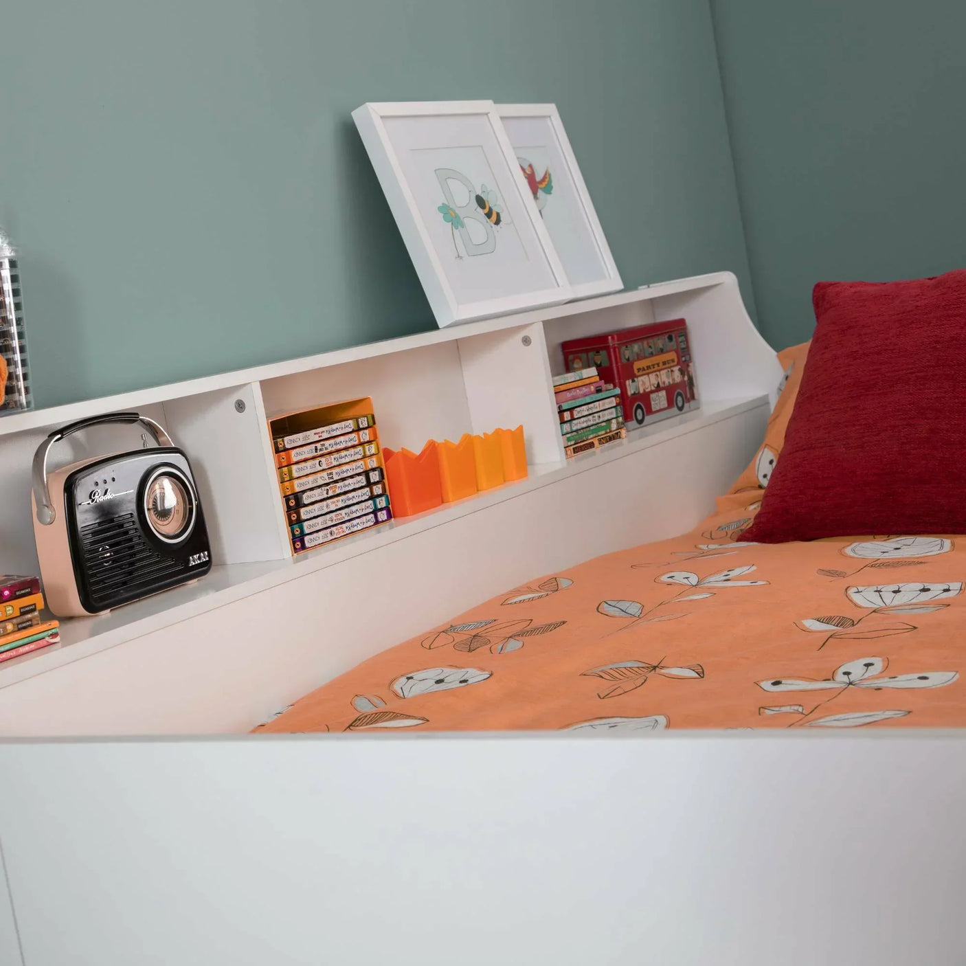 Jupiter midsleeper white headboard shelf with books, toys and orange bedding