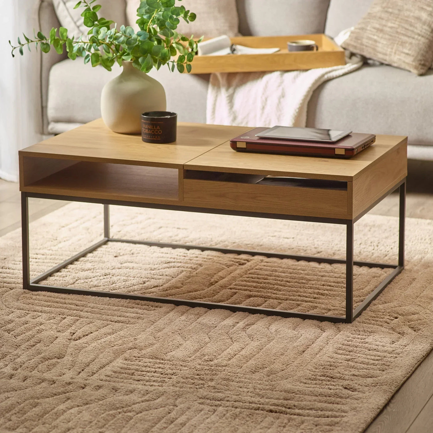 Oak coffee table with metal frame, open shelves, styled with vase and decor in living room