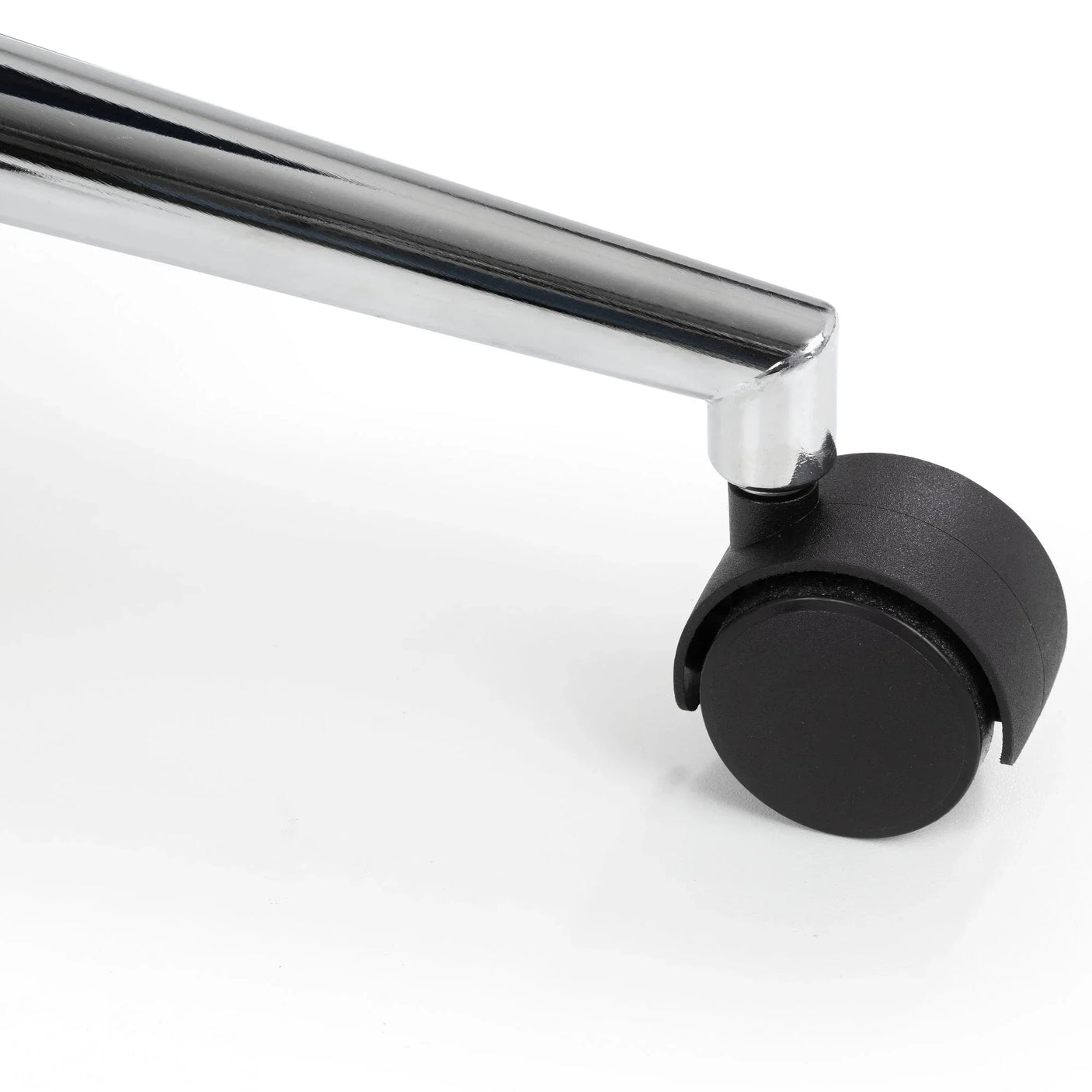 Close-up of office chair caster wheel with chrome leg