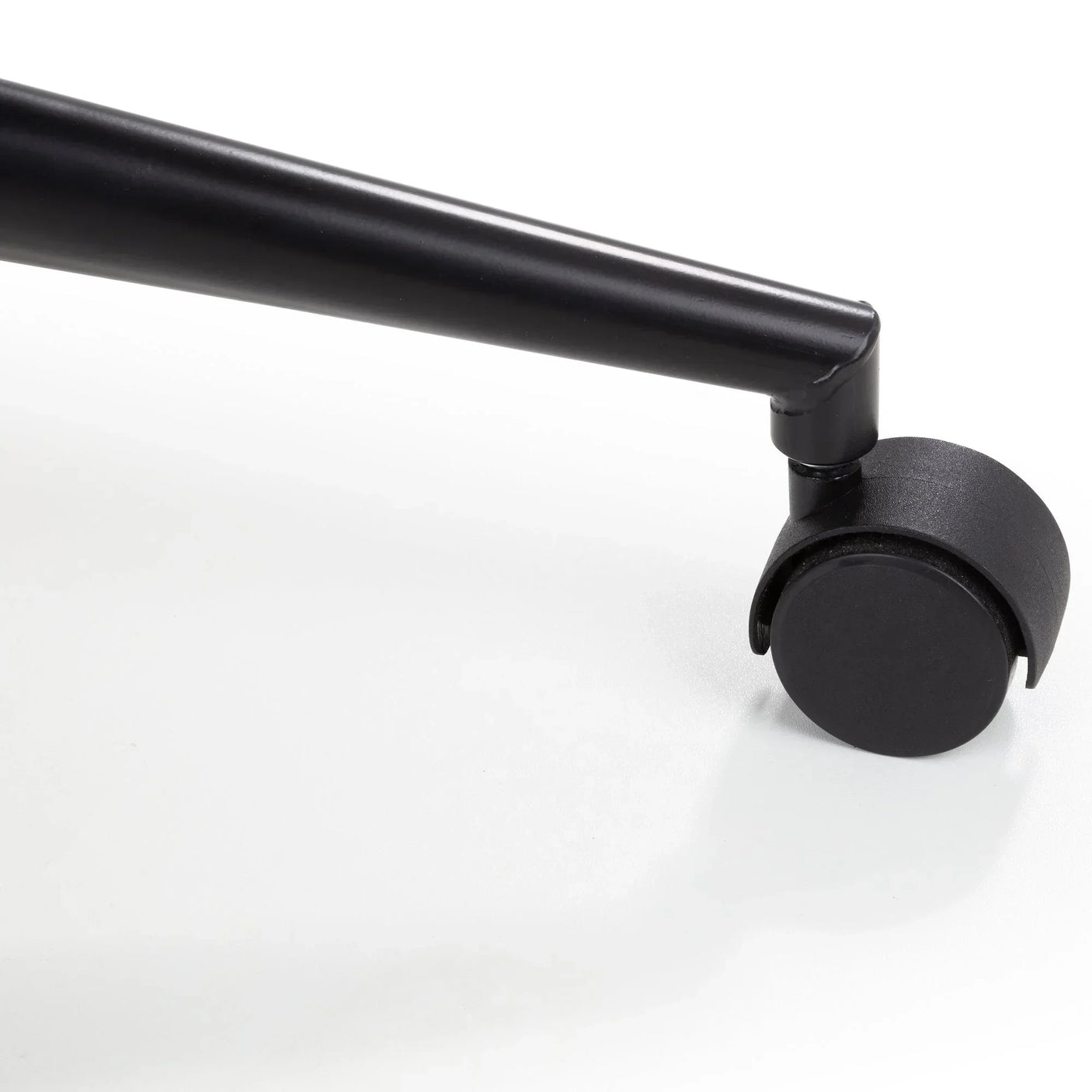Black office chair wheel and metal leg detail on white background