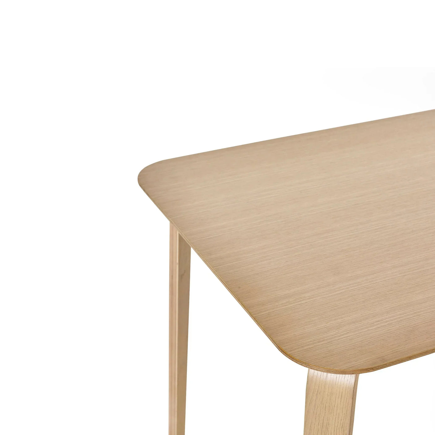 Kaito coffee table close-up showing light wood finish and rounded corner