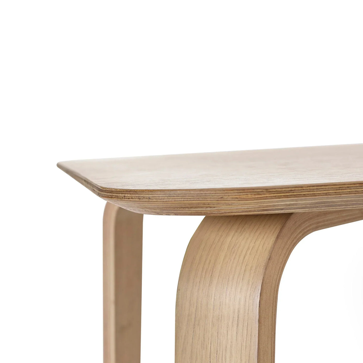 Close-up of Kaito coffee table corner showing light wood finish and curved leg detail