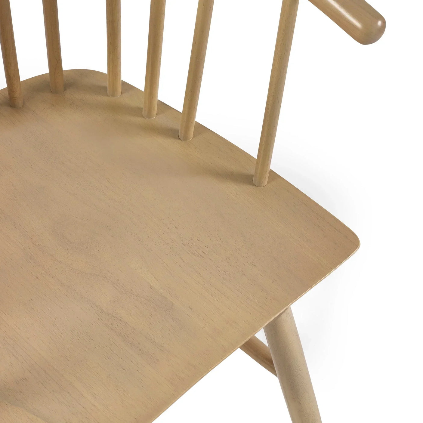 Natural wood dining chair seat with round spindles and light oak finish, close up view