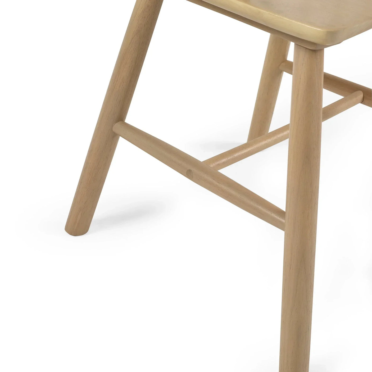 Close-up of wooden chair legs with light natural finish and crossbar support