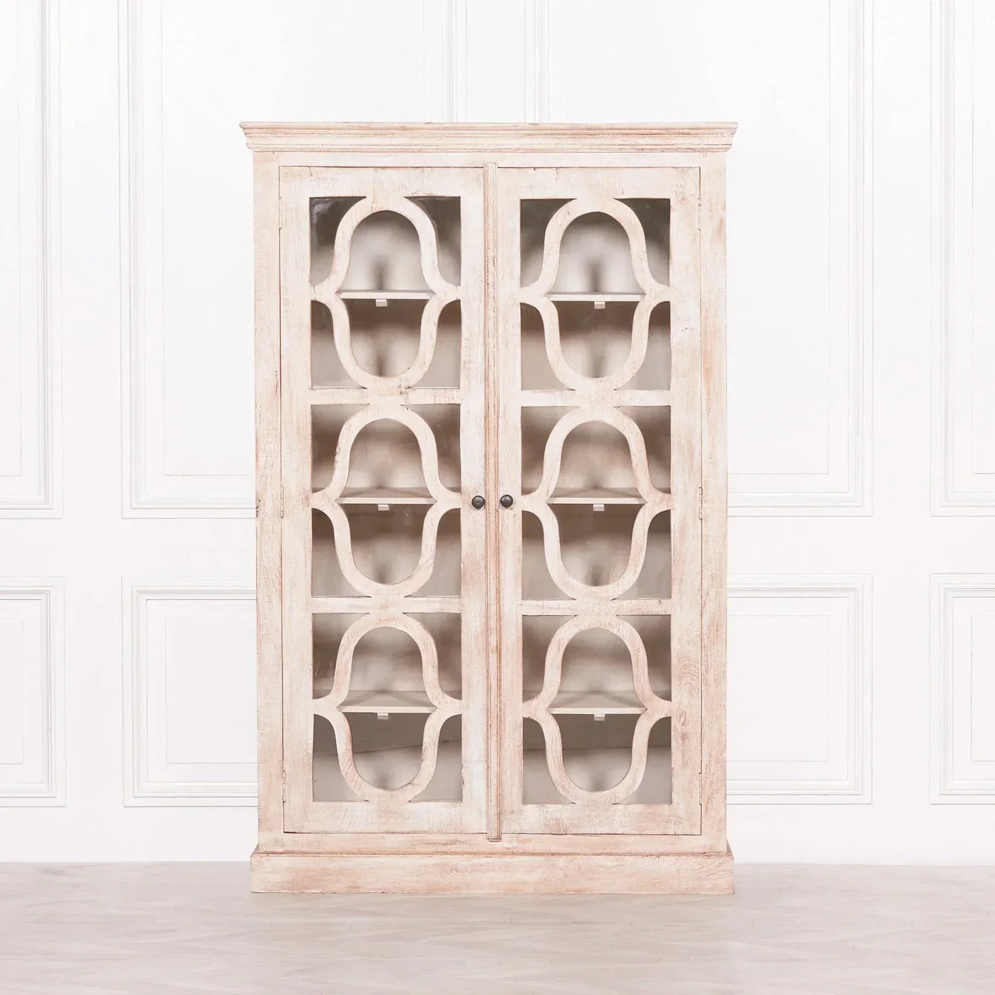 Distressed wood display cabinet with glass doors and decorative geometric pattern