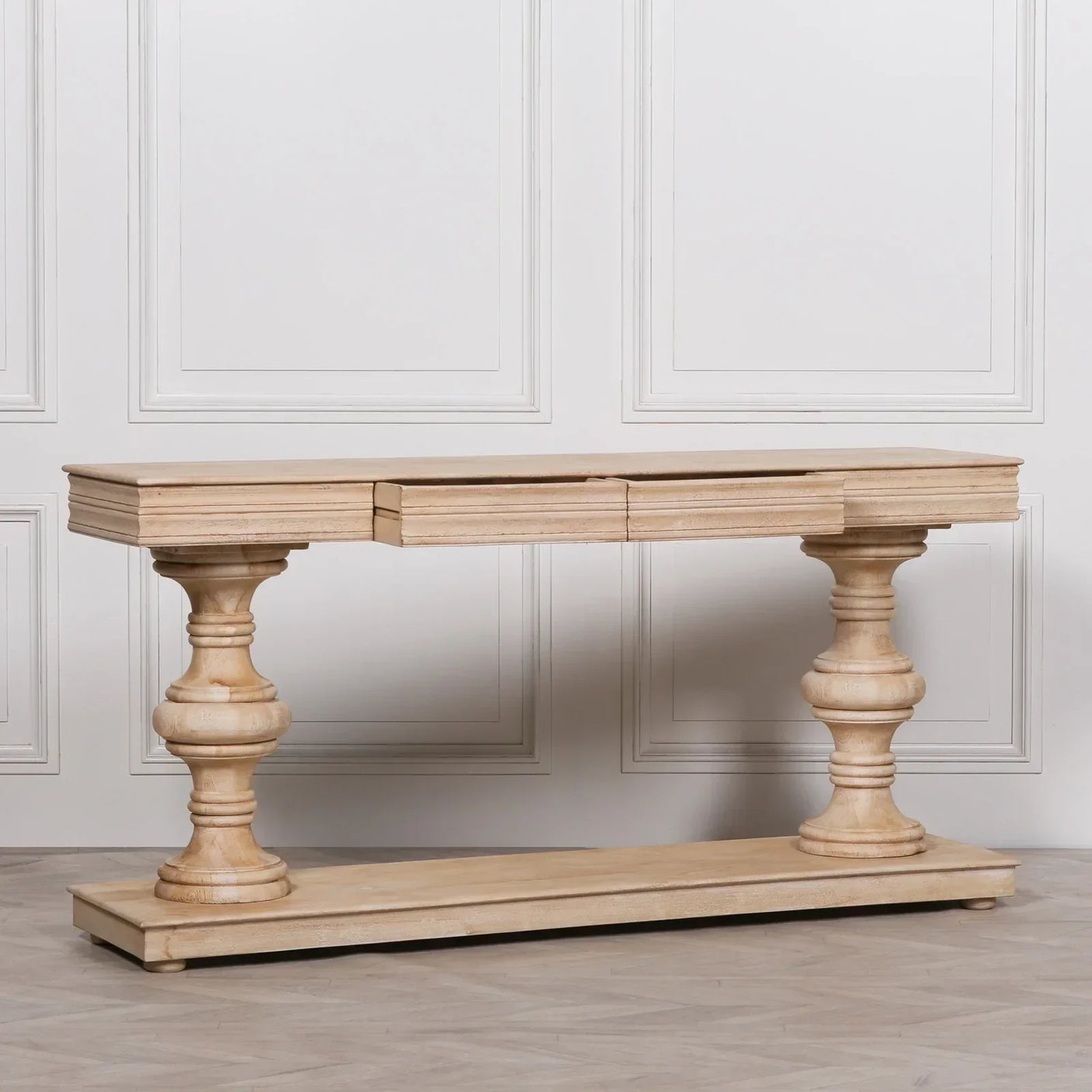 Natural wood console table with two turned pedestal legs and rectangular top