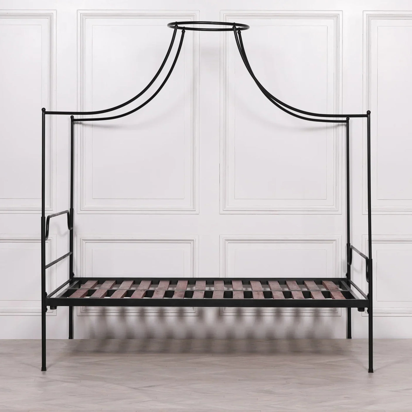 Black metal canopy bed frame with slatted wooden base and modern design