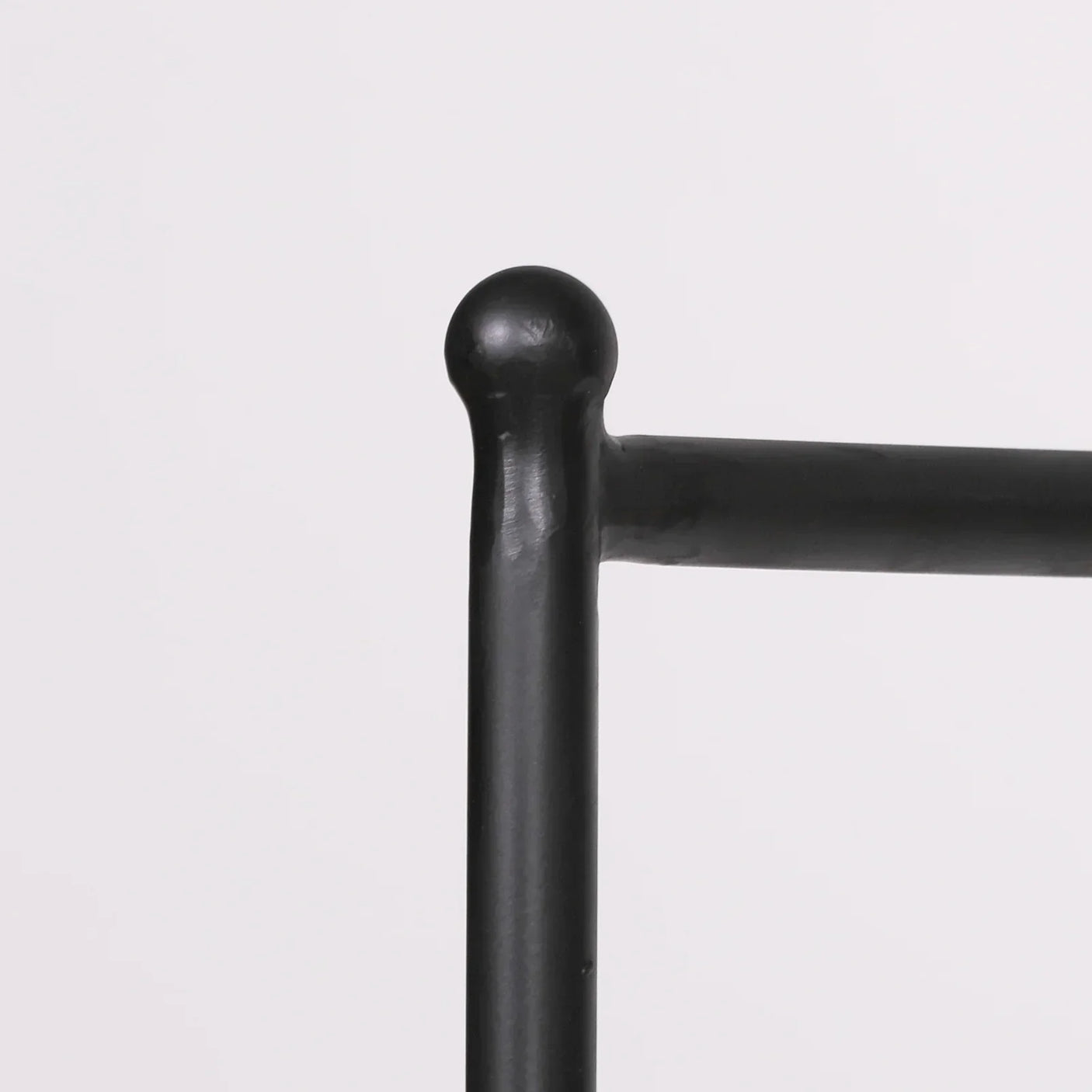 Black metal bed frame post with rounded top and horizontal bar