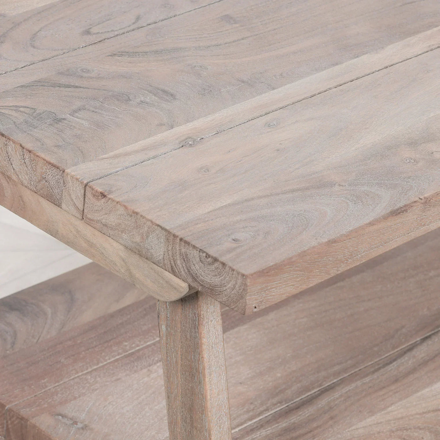 Closeup of solid wood coffee table with natural grain and lower shelf