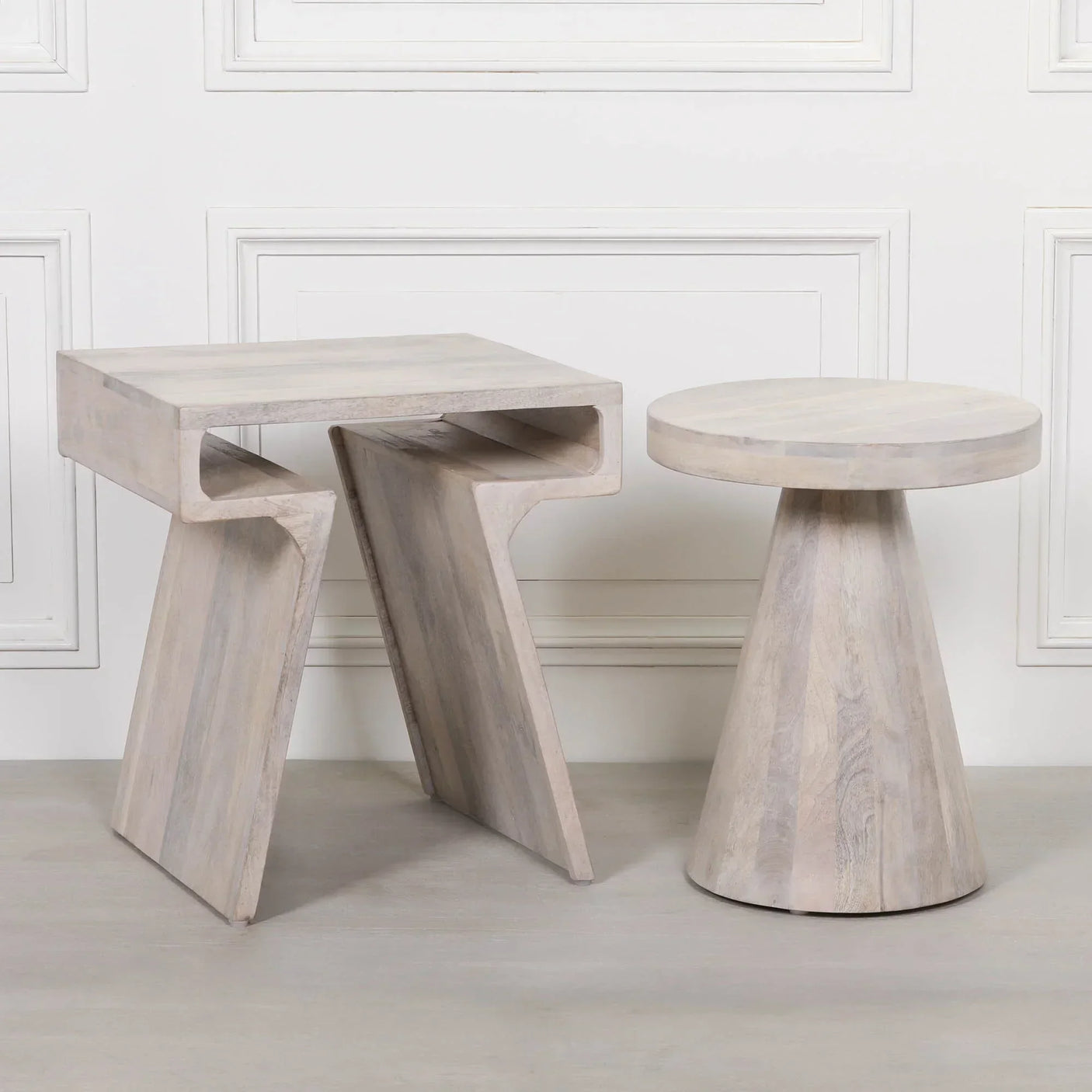 Set of modern light wood side tables, one square with open base, one round with cone base