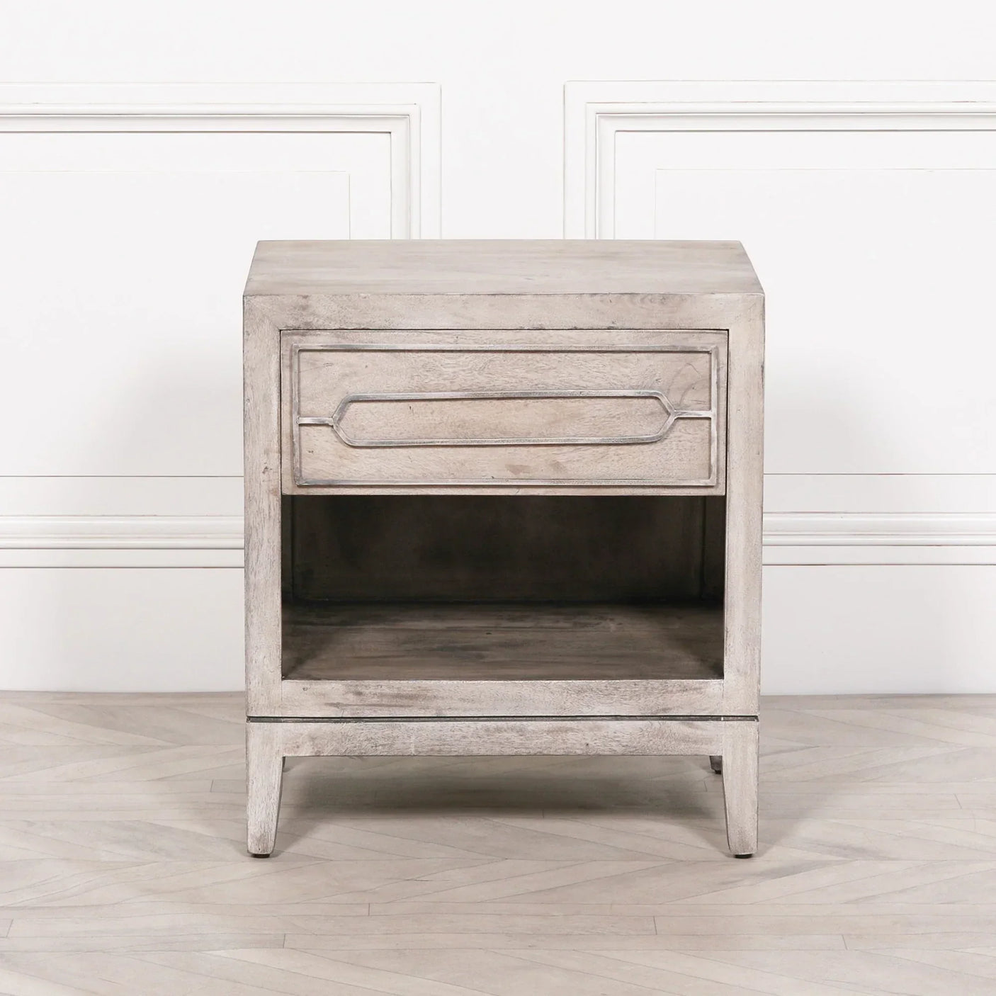 Light wood bedside table with single drawer and open shelf, front view on white background