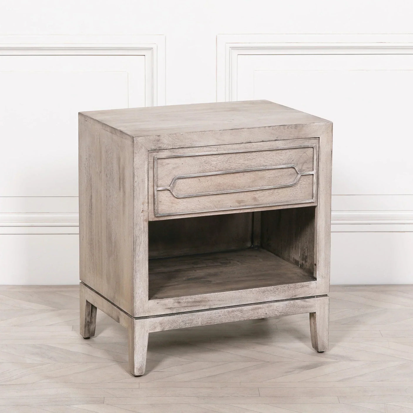 Rustic wood bedside table with single drawer and open shelf on light flooring