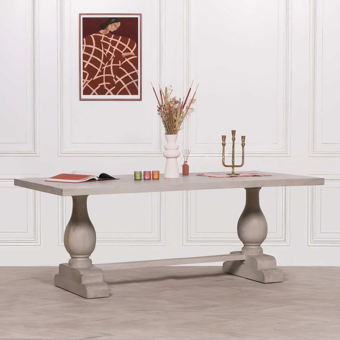 Rectangular wood dining table with pedestal legs in modern room setting