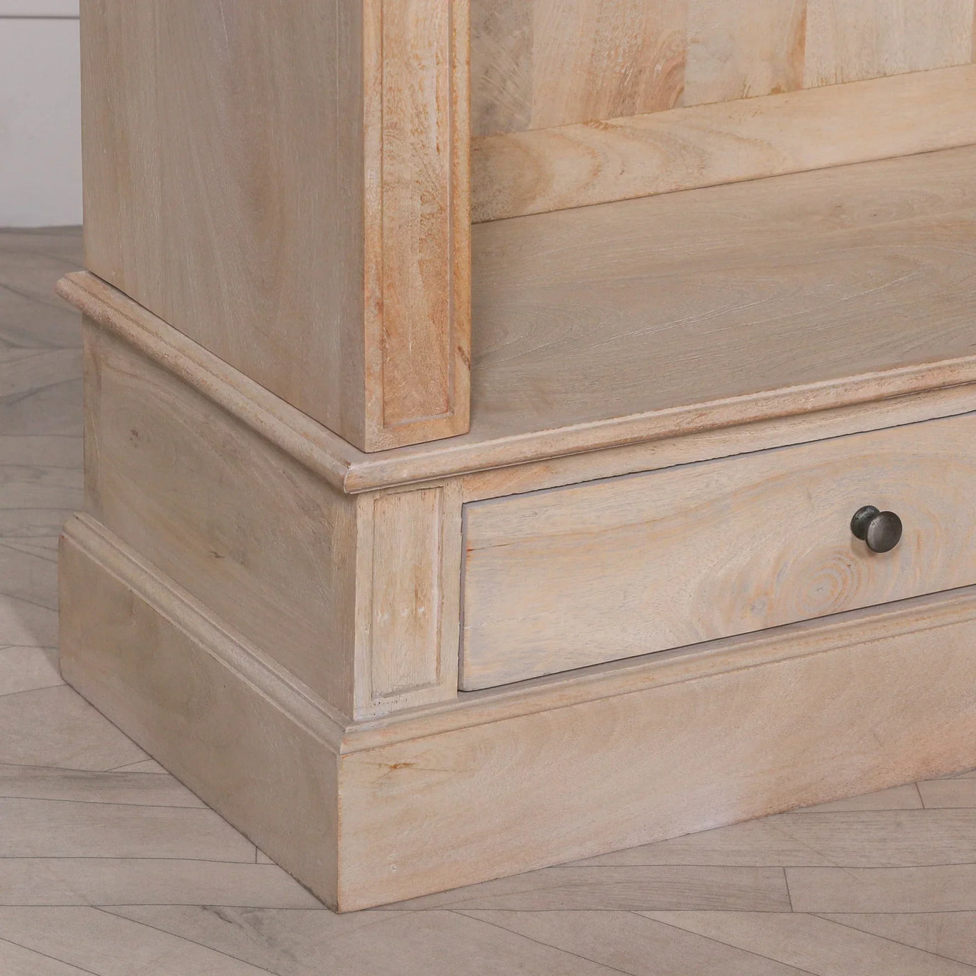 Light oak bookcase base corner with storage drawer and black knob handle