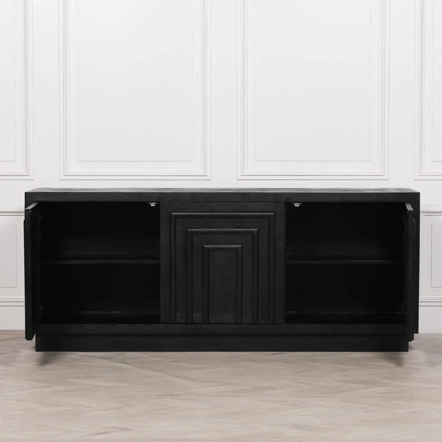 Black sideboard with geometric front panels, open cabinet doors, and interior shelving