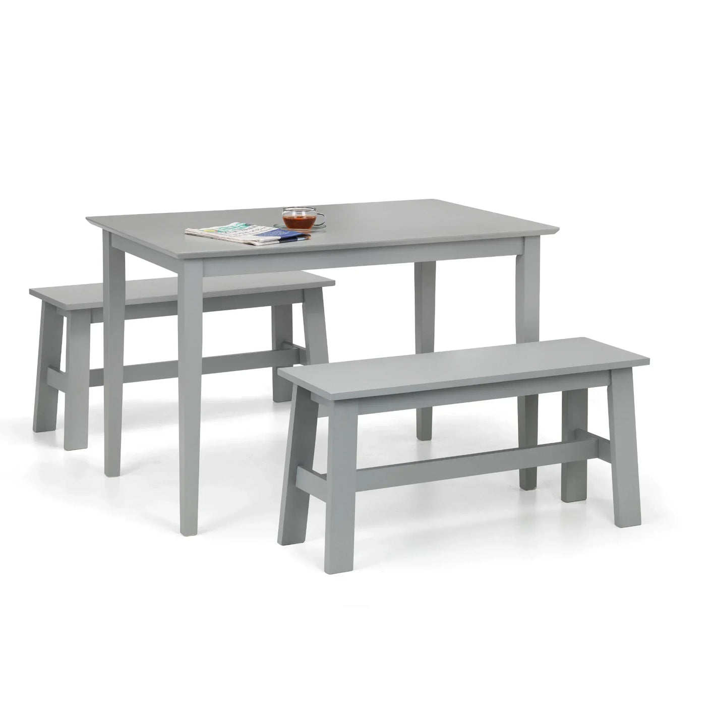 Grey rectangular dining table with two matching benches and minimal tabletop accessories