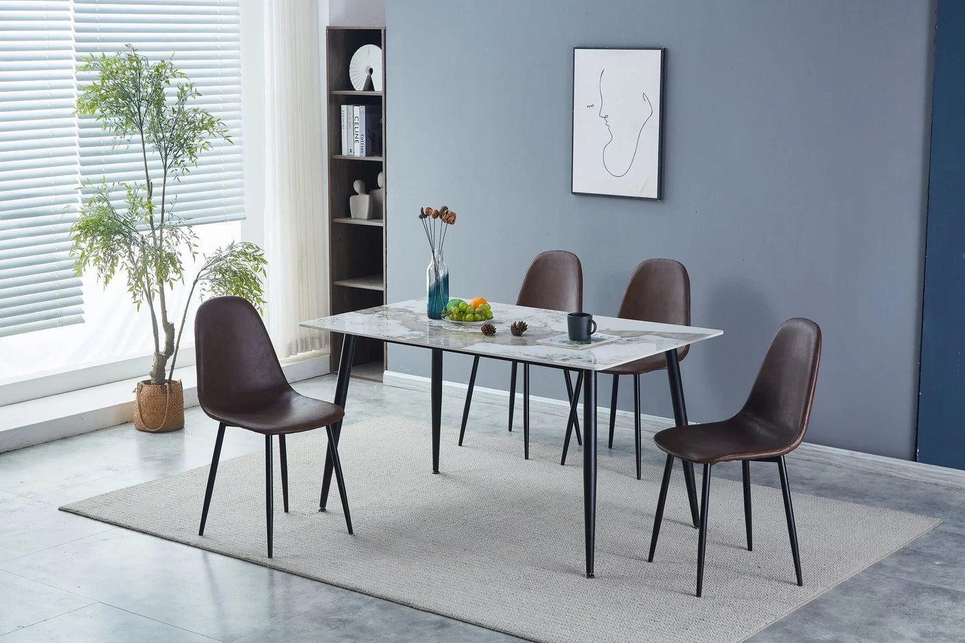 White marble dining table with black legs and four brown chairs in a modern dining room