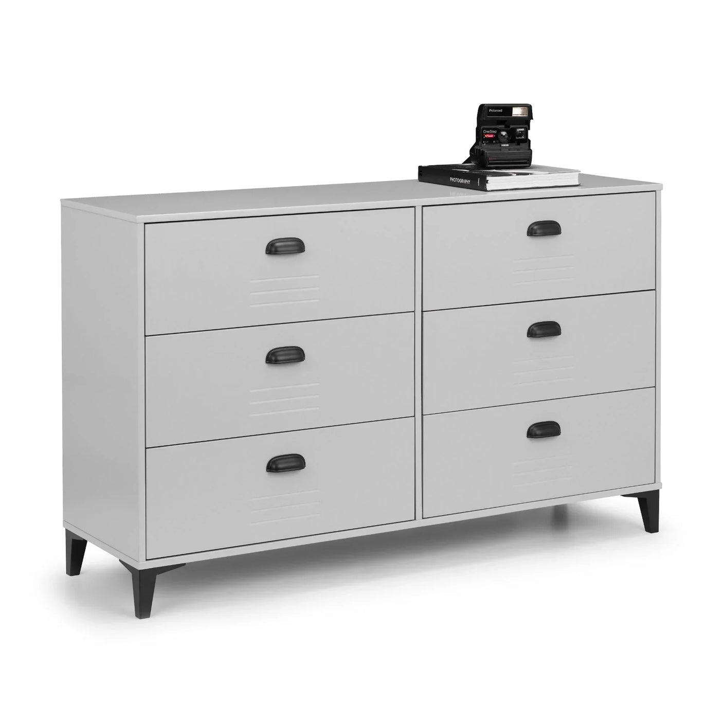 Grey locker style 6 drawer chest with black handles and legs, camera and books on top