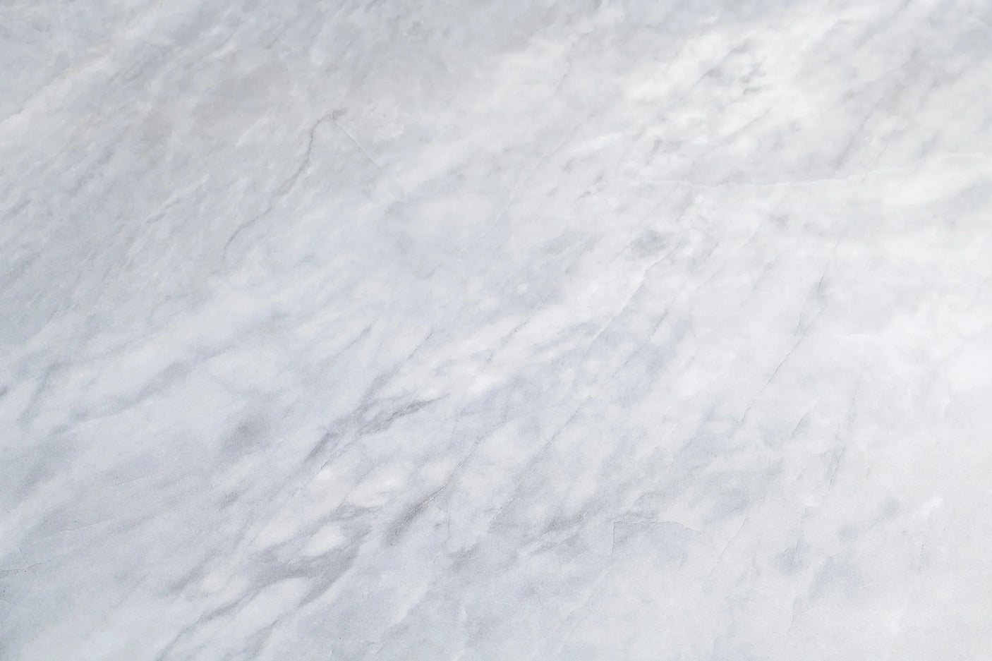 close up of light grey marble effect surface with subtle veining