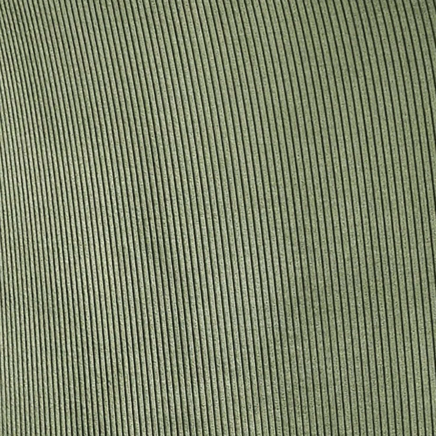 Green corduroy upholstery fabric close-up showing textured vertical lines