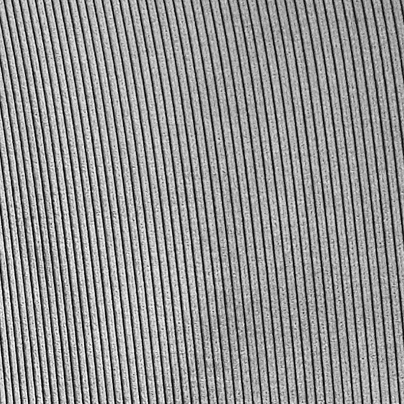 Close-up of grey corduroy fabric upholstery with fine vertical ridges