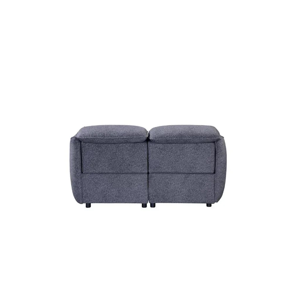 Back view of grey fabric reclining sofa with plush cushions