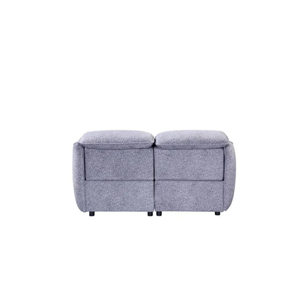 Grey fabric two-seater sofa rear view with padded backrest and armrests