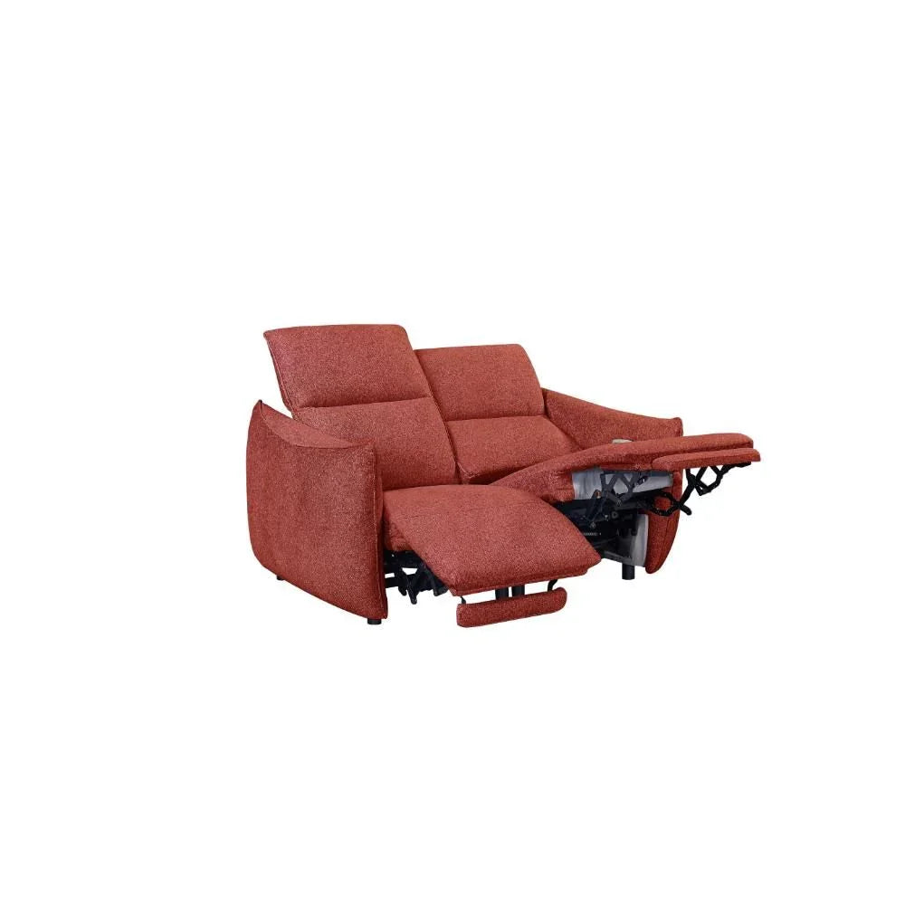 Rust fabric reclining sofa with extended footrests and padded backrest, angled front view
