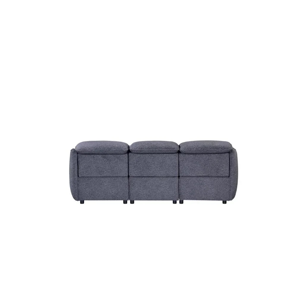 Back view of three seater grey fabric sofa with plush cushions and contemporary design