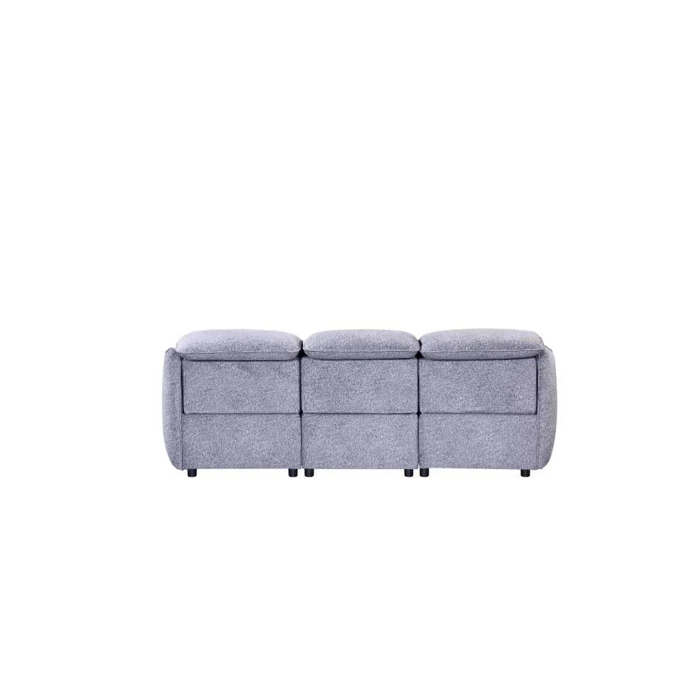 Grey fabric three seater sofa rear view with padded backrests and modern design