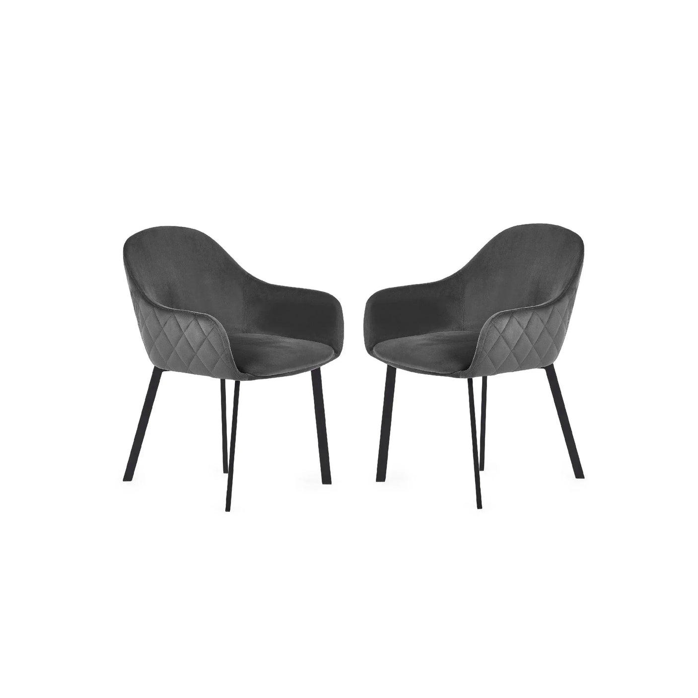 Pair of grey velvet dining chairs with quilted sides and black metal legs on white background