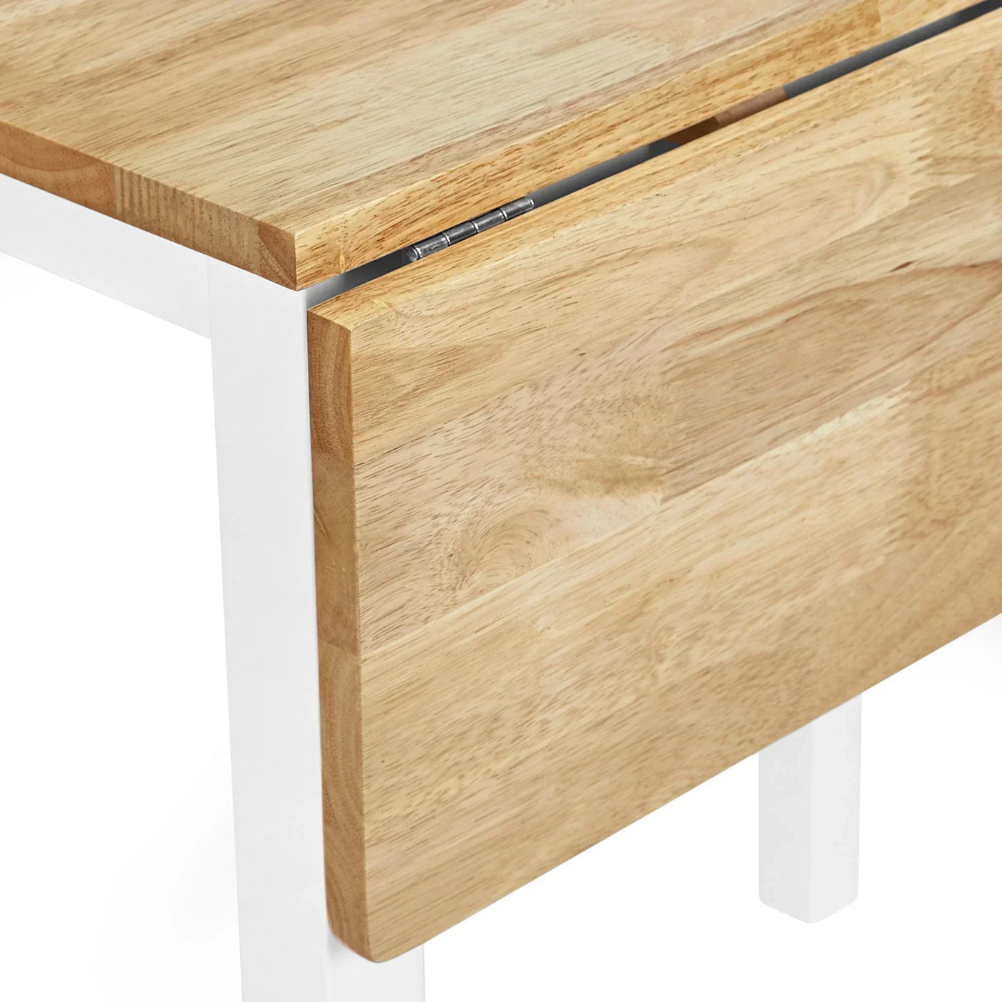 Closeup of drop leaf dining table with light wood top and white metal legs
