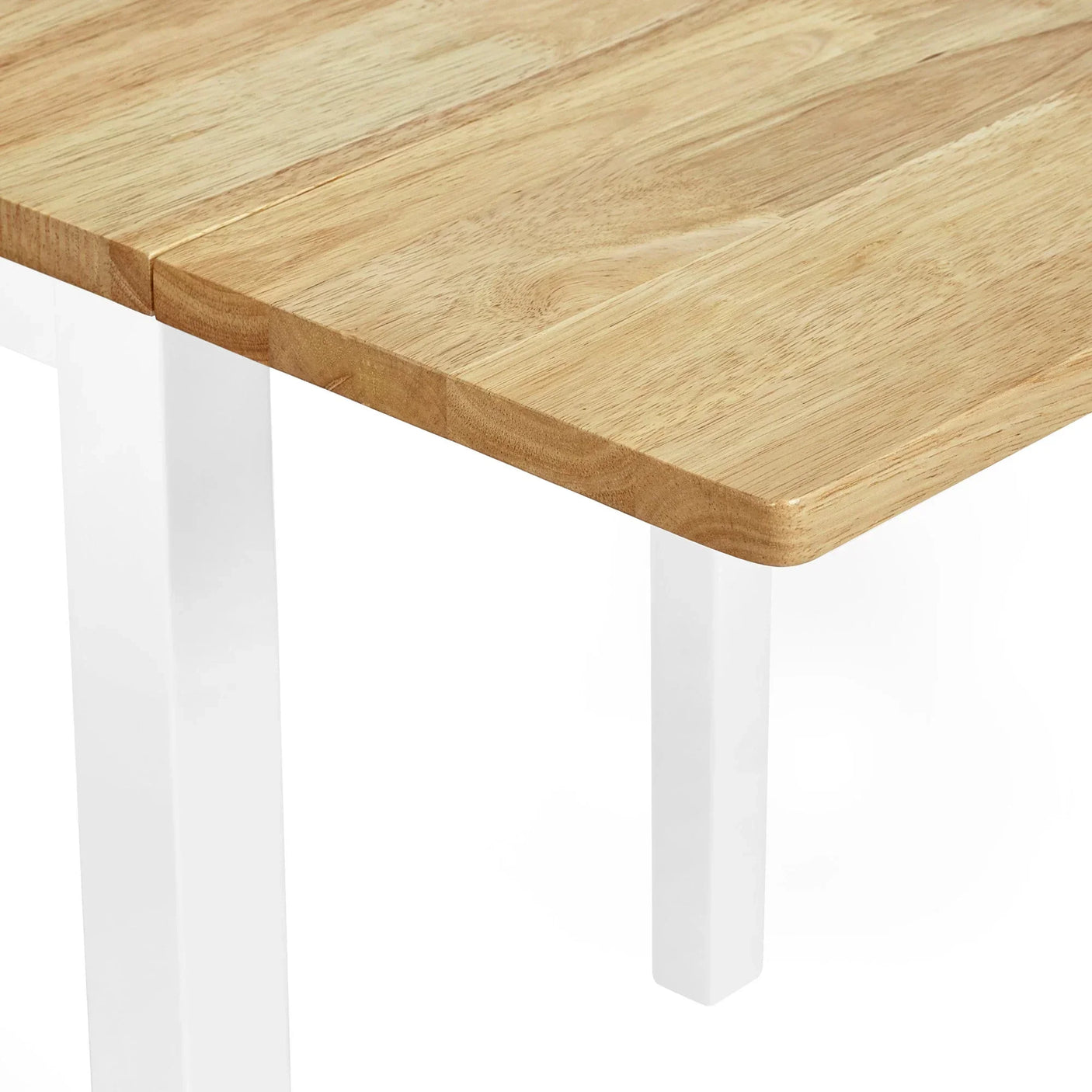 Oak wood dining table with white metal legs, close up of tabletop corner