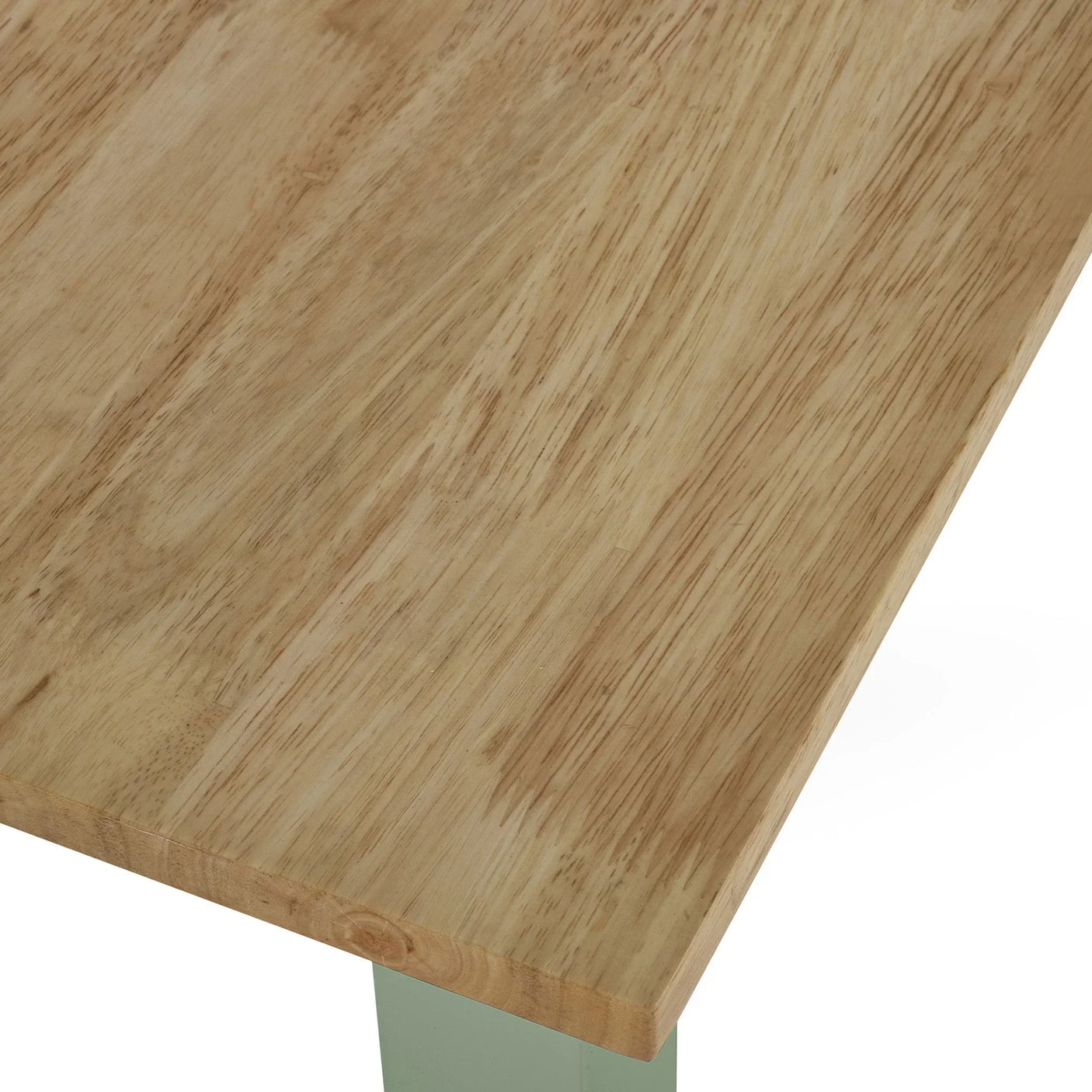Closeup of light wood dining table top with corner detail and subtle grain pattern