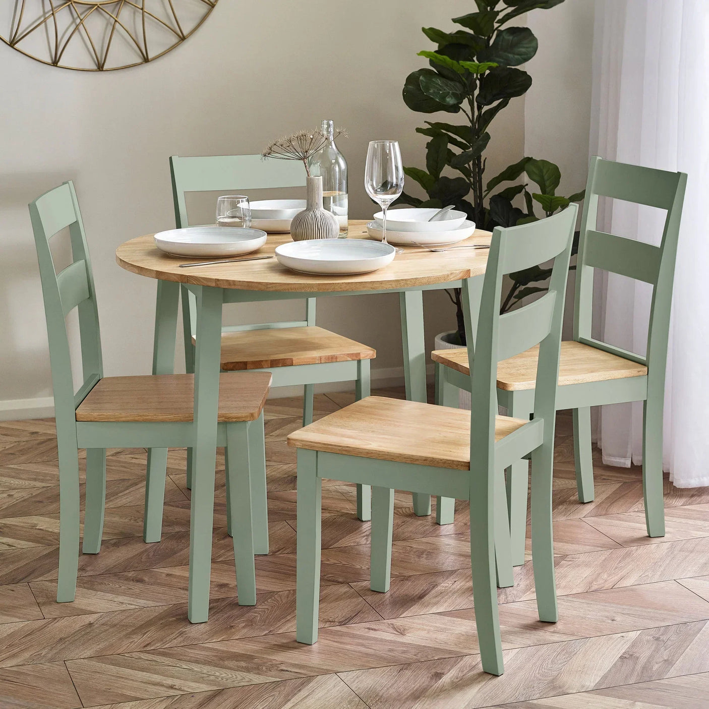 Round wooden dining table with mint green chairs in modern dining room