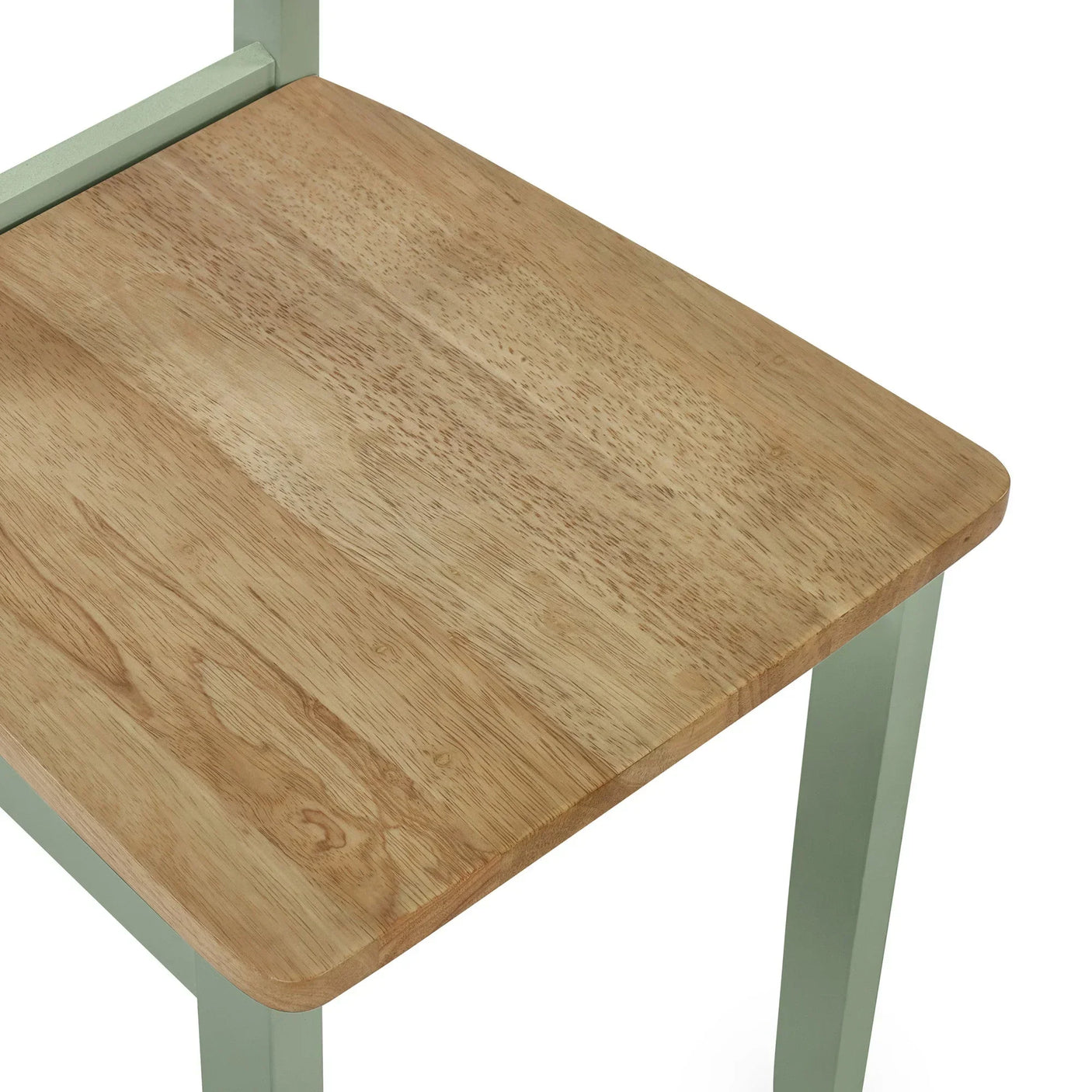 Closeup of wooden dining chair seat with light green painted legs