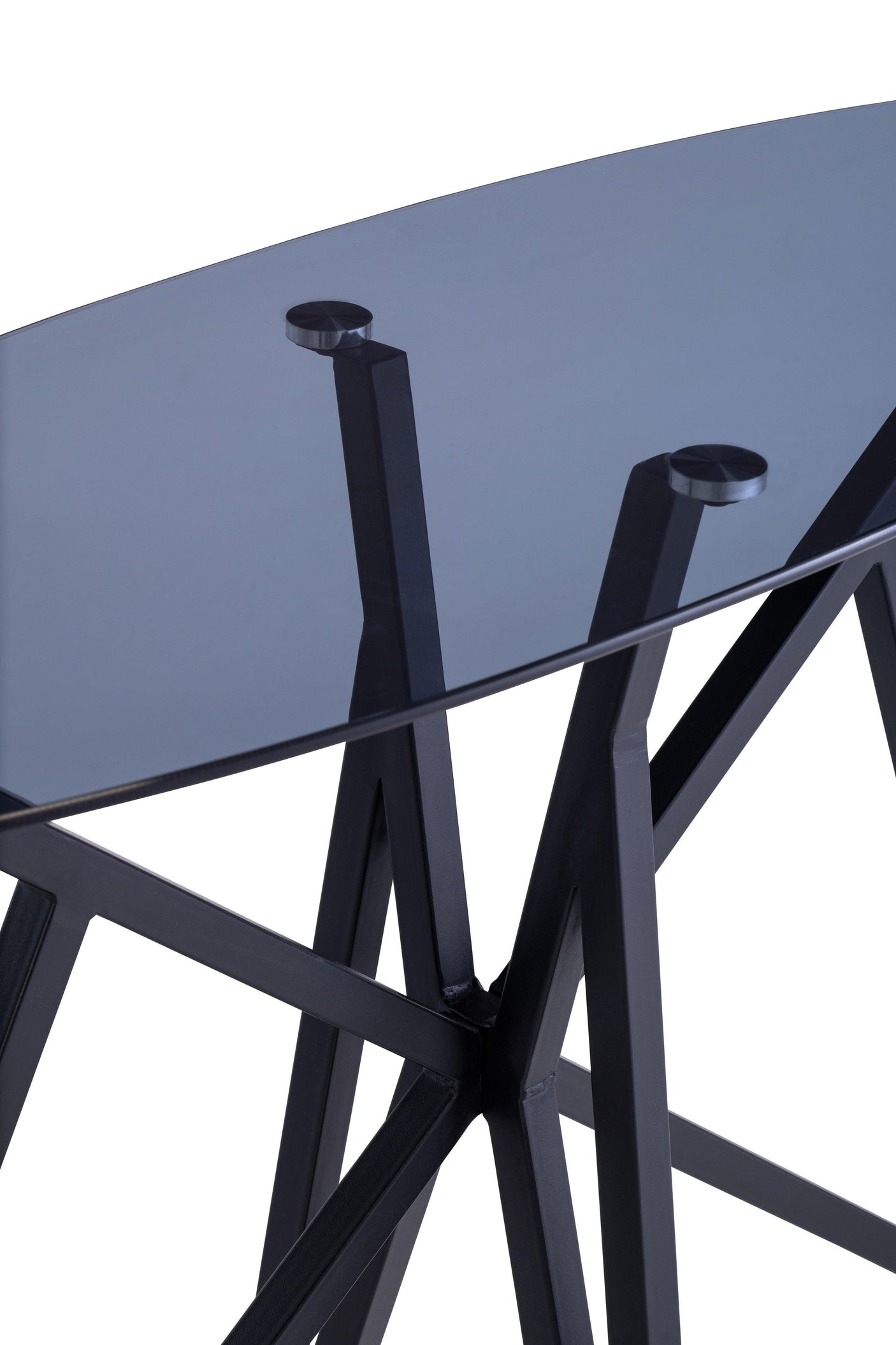 Black glass console table close-up showing metal legs and smoked glass top