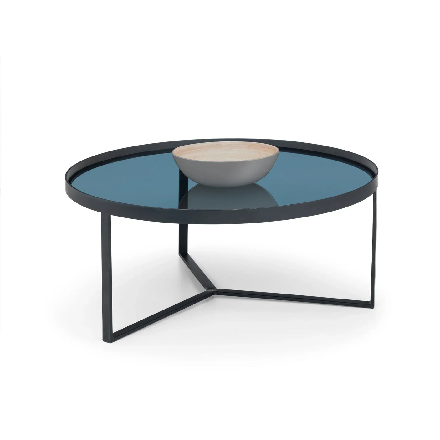 Round smoked glass coffee table with black metal frame and decorative bowl on top