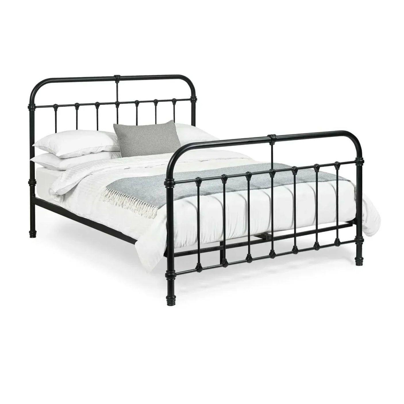 Black metal bed frame with vertical bars and white bedding, side angle view